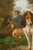 A Belgian signed Joost-Vincent De Vos oil on canvas dog painting from the 19th century depicting hounds and a young boy...