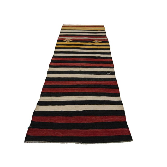 Striped Vintage kilim rug from Malatya region of Turkey. Approximately 50-60 years old. In very good condition.