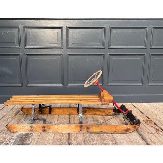 Original vintage steerable sledge or steerable toboggan. This sledge, often referred to as a bobsleigh, features two...