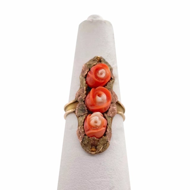 This is part of Chairish’s Fine Jewelry assortment. Ths is a lovely Victorian period ring featuring three carved coral...
