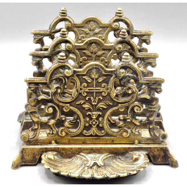 Art Nouveau solid brass letter rack with a lovely pierced design and swirls. It features two slots for letters and...