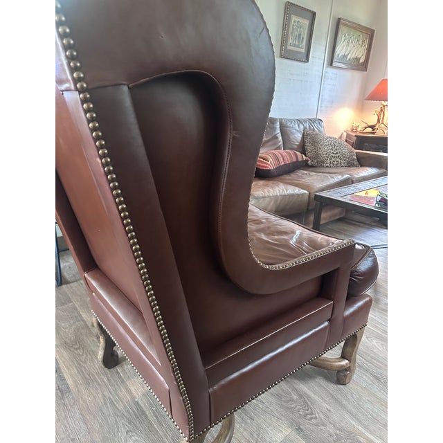 Bring timeless warmth and classic character to your space with this magnificent oversized wingback lounge chair by Century...