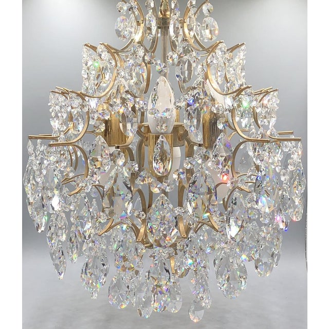 This magnificent vintage crystal chandelier from Italy is a truly stunning example of elegant lighting art. Manufactured...