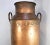 A large antique copper milk pail from Holland. Front has the farm name, “C Z De Takoms” and back has number “7658”. Pail...