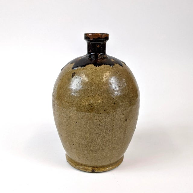 A pretty light and dark brown saki bottle that can also be used as a vase
