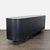 This sideboard is crafted from solid oak with natural knots and grain variation that add depth to the aged black finish....