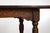 An English oak table from the 19th century with carved apron, turned legs and H-Form cross stretcher. An English oak table...