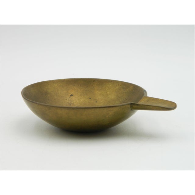 Ashtray model 4082 from the Carl Auböck workshop in Vienna. This bowl consists of a solid brass hemisphere with a rest for...