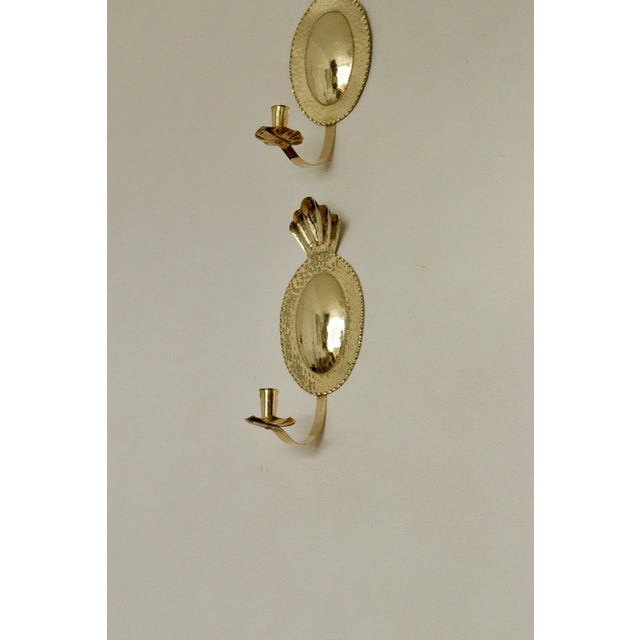 Made in Sweden Pair of original mid‑century Swedish hammered brass sconces, designed by Sonja Nashult in 1957. Each sconce...
