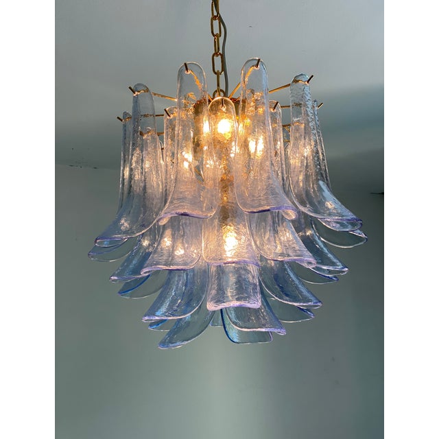 Contemporary and vintage Mazzega style chandelier. Blue transparent “Selle” elements in Murano glass, glass elements...