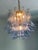 Contemporary and vintage Mazzega style chandelier. Blue transparent “Selle” elements in Murano glass, glass elements...