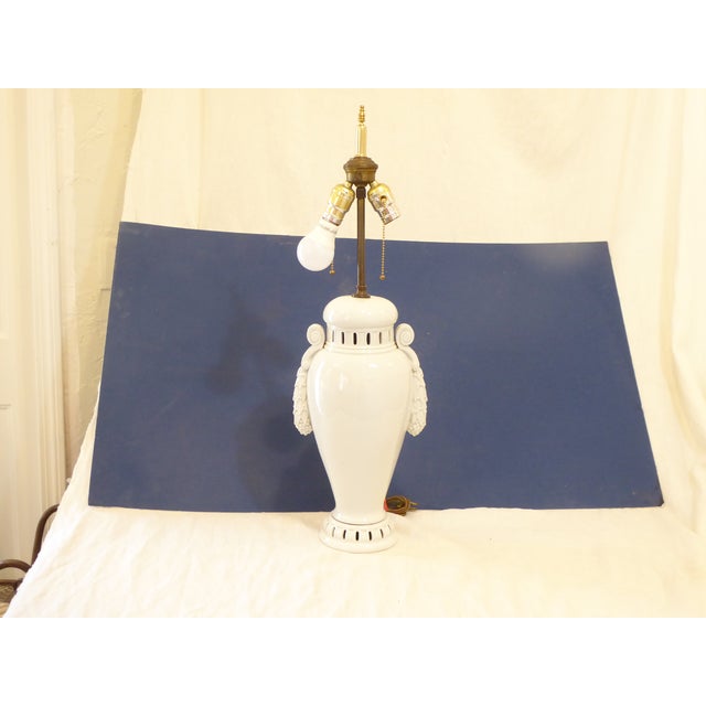This Neoclassical style continental porcelain lamp uses two Edison base bulbs up to 100 Watts each.