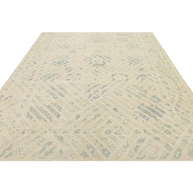 Transform your home with this hand-knotted Modern Oushak rug, blending old-world craftsmanship with contemporary style....