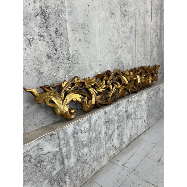 Dimensions: 123cm wide x 18.5cm high x 3cm deep An incredible and unique door surround from Burma in the 18th century....