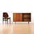 This vintage mid-century china cabinet was produced in England during the 1960s. Made from teak, this minimalist cabinet...