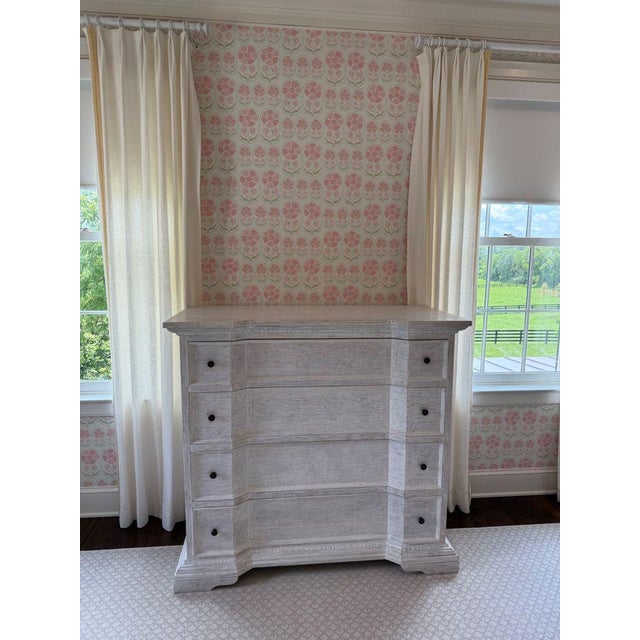 Pretty inverted bow-front dresser by Noir, featuring a whitewashed finish that allows the wood grain to show through. Each...