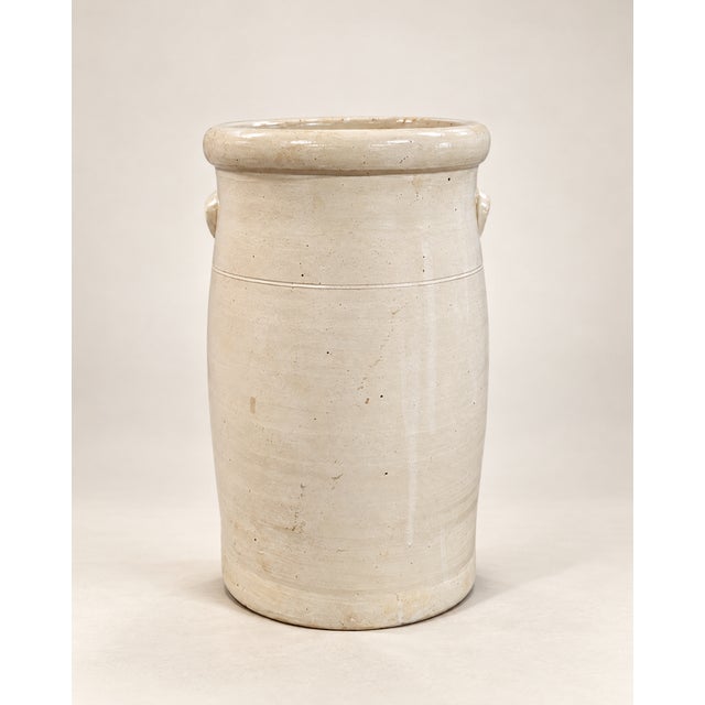 An antique three-gallon stoneware churn bearing the oval Union Stoneware Co. mark from Red Wing, Minnesota. Finished in a...
