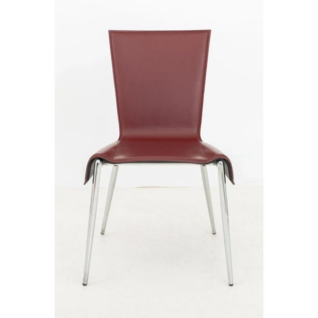 Postmodern Burgundy Red Leather Side Chair, on four tubular tapering chrome legs. 33.75" H x 20.5" W x 24" D; seat: 18" H....