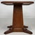 A charming early 20th-century English side table, finely crafted from oak and distinguished by its substantial square-form...