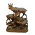A hand carved wooden sculpture of a chamois group with buck, chamois and fawn. A very fine and natural carving by the...