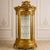 Elevate your interior with this spectacular French Baroque-style display cabinet, featuring an elaborate gold leaf finish,...