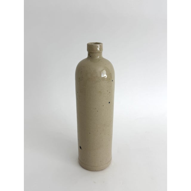 Commonly used throughout the 19th and early 20th century, these French salt glazed stoneware bottles were utilitarian...
