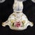 This is an Alboth and Kaiser five candle candelabra in white with pink and yellow dimensional flowers (or Capodimonte...