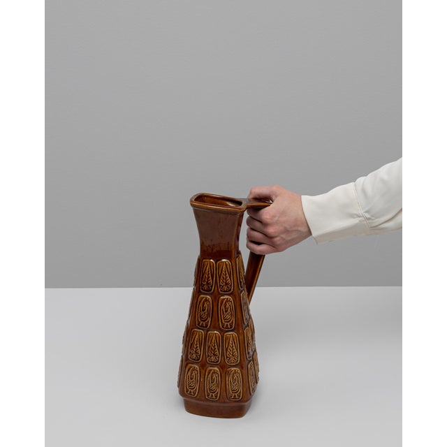 20th Century German W. Germany ceramic vase. This geometric, mid-century vase showcases the signature craftsmanship of...