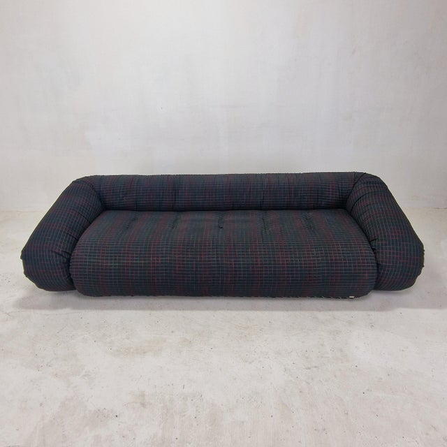 This extraordinary "Anfibio" three-seater sofa bed, designed in 1970 by Alessandro Becchi alongside the innovative...