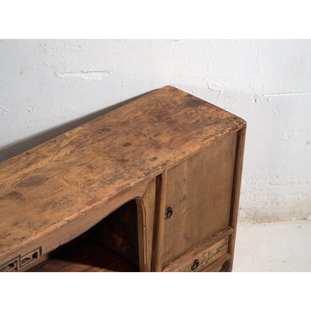 Antique low sideboard in pine wood, Chinese provincial furniture originating from Gansu and dated circa 1930. Originates...
