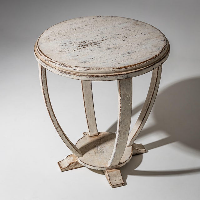Art Deco side table with a beige-white painted finish and a round tabletop. The painted finish is new and has been antiqued.