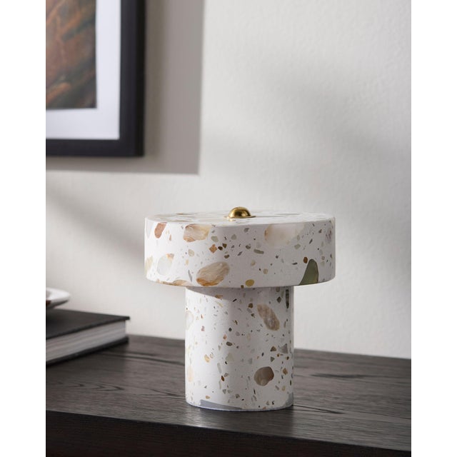 Illuminate your space with the Tessari accent table lamp, a perfect embodiment of minimalist modern design. Standing at a...