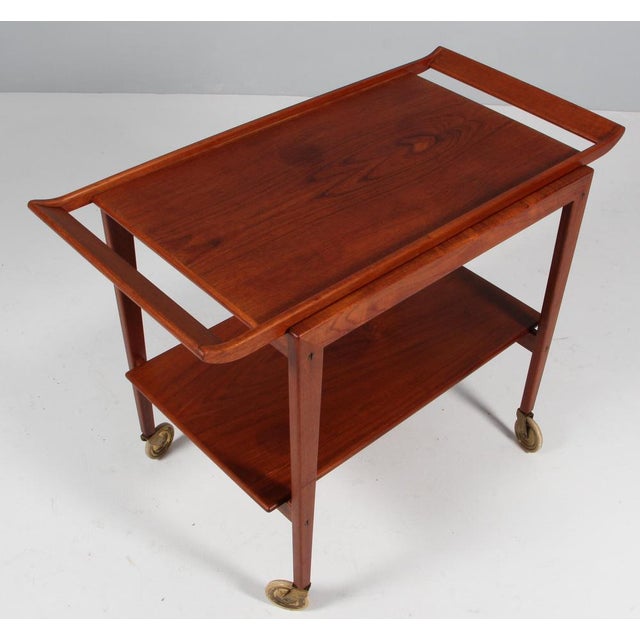 Peter Hvidt & Orla Mølgaard Nielsen tray table in partly solid teak. Made by Søborg Møbler in the 1960s. This piece is...