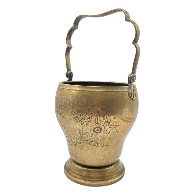 This stunning late Victorian brass ice bucket exudes timeless charm and elegance. The front and back showcase intricate...