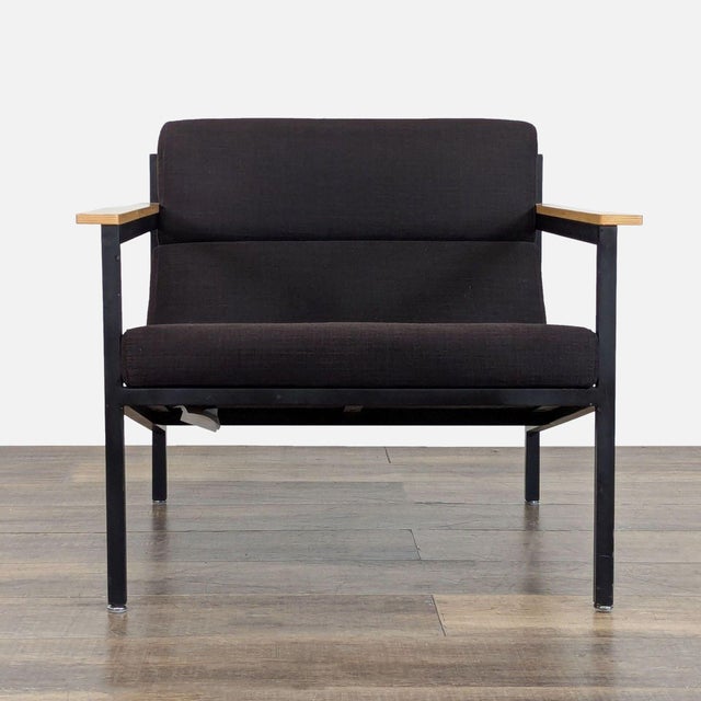 Features a powder-coated steel frame, solid wood paddle armrests, and faceted upholstery panels. Brand: Gus*. Model:...