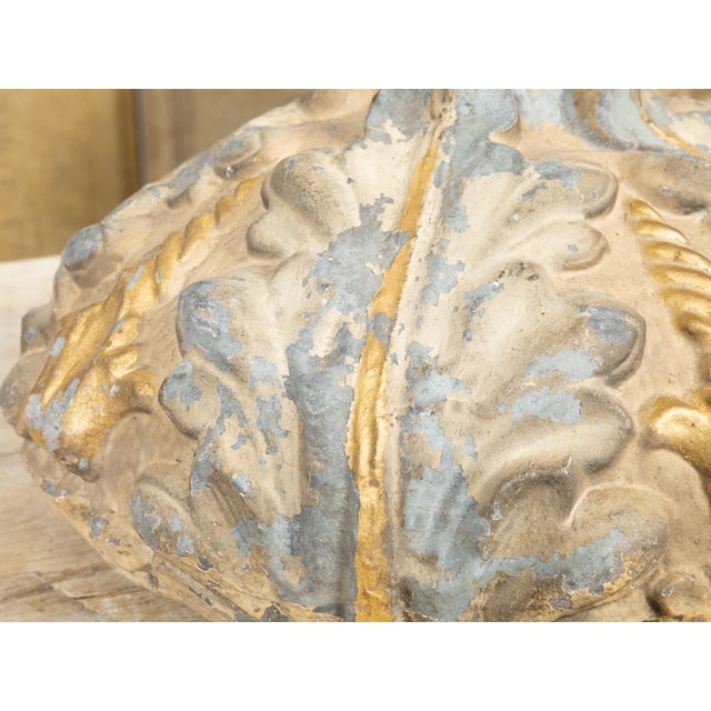 An Italian bed corona from the 19th century, with painted and gilt décor and nicely weathered patina. Created in Italy...
