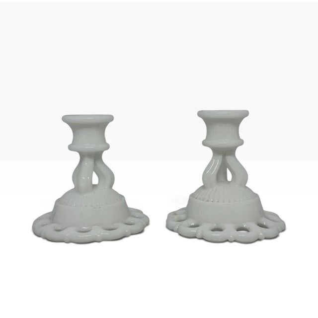 Add a touch of classic romanticism to your next design project with this pristine pair of mid-century Westmoreland white...