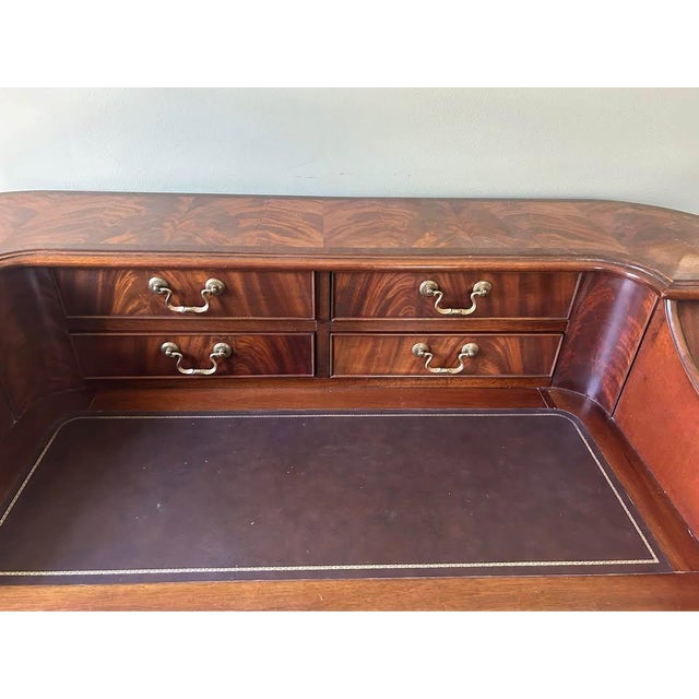I have a Stunning American of Martinsville English Mahogany Inlaid & Leather Top Carlton Writing Desk. This gorgeous desk...