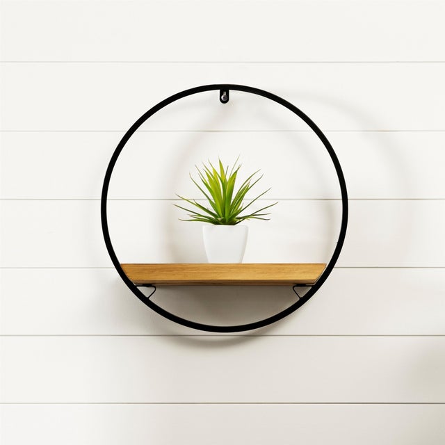 Add style and functionality to your wall with this eye-catching Circle Shelf. Crafted from durable wood and iron, its...