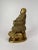 Bronze metal buddha. Depiction of buddha seated upon a large cushion and flanked by a pair of foo lions