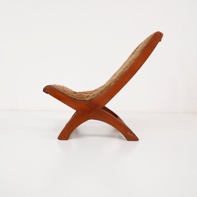 We offer this Antique Petite Mexican Butaque in the style of Clara Porset, circa 1960.