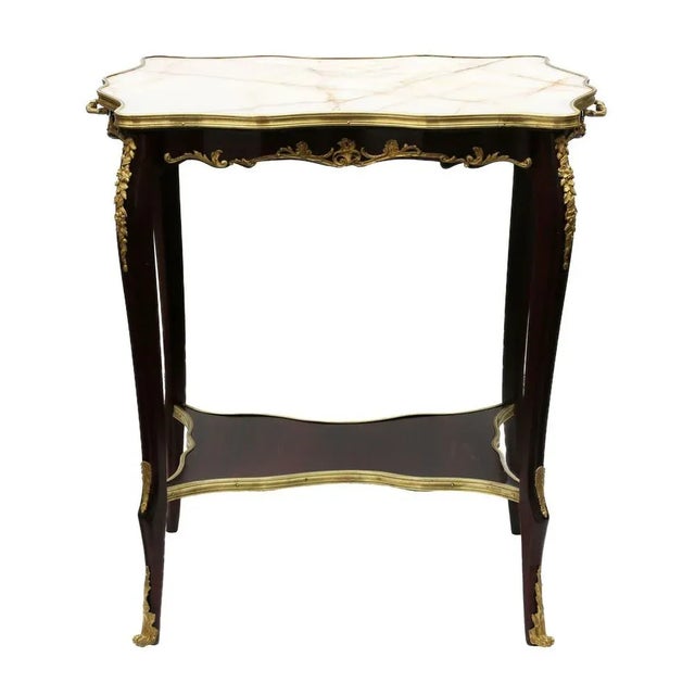 Serving table in mahogany, gilded bronze with marble top from the turn of the 19th and 20th centuries, in the 3rd Rococo...