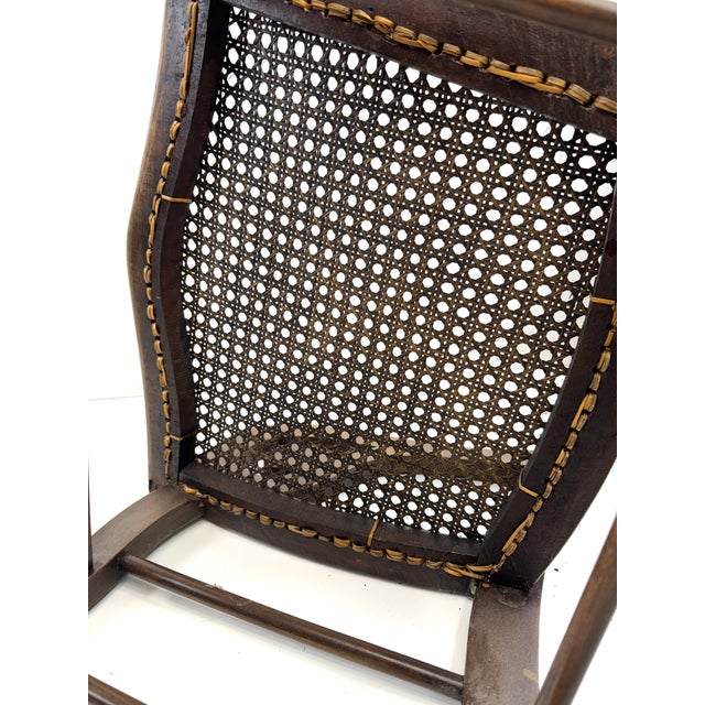 Antique Late 19th Century Cane-Back Rocking Chair With Carved Scroll Arms For Sale - Image 11 of 12