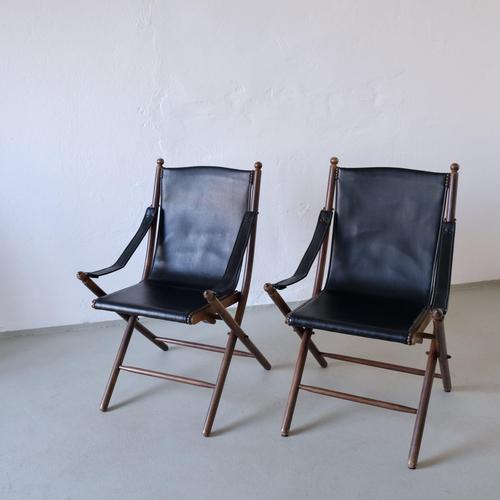 Vintage folding set consisting of two safari chairs and a folding tray table. The chairs have wooden frames with black...