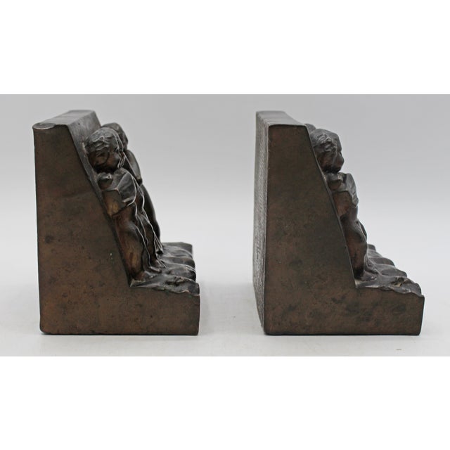 Metal Circa 1900 Pair of Bronze Plated Bookends Featuring Reliefs of Putti For Sale - Image 7 of 8
