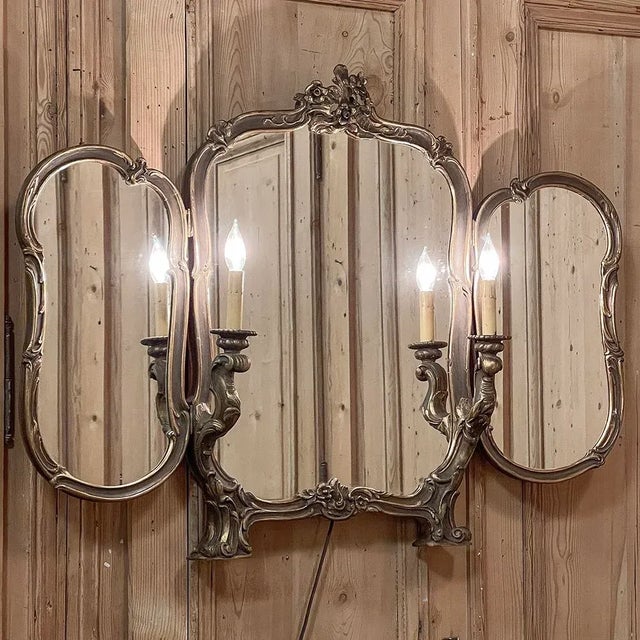 Antique Italian Rococo Tri-Panel Mirror with Lighting features a subtle patinaed gold finish that will add just the right...