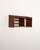 Teak wall shelf featuring asymmetrical open compartments, with two thin shelves on the left side and a larger compartment...