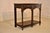 19th century English oak small potbound/console table with lovely hand carved decoration. The top of this piece is made...