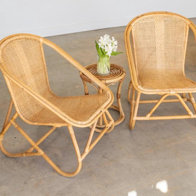 Lovely pair of woven chairs from Italy, 1960's. Light woven wicker scoop seats with rattan and bamboo frame. Original...