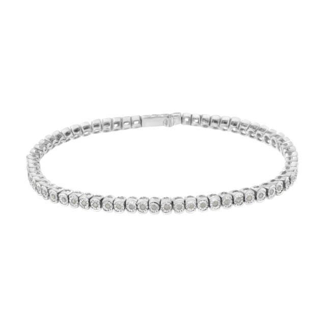 Elegant and timeless, this gorgeous sterling silver link bracelet features 0.5 carat total weight of round diamonds with a...